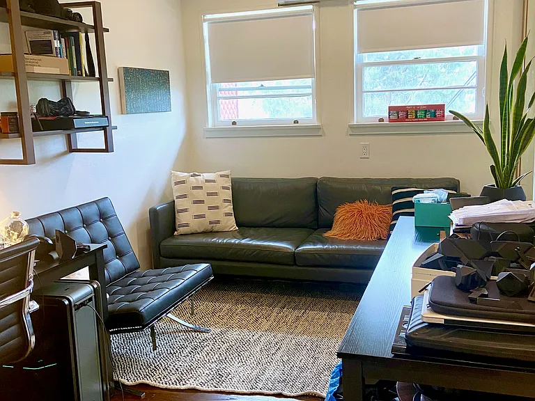 Second bedroom shown as a furnished home office.