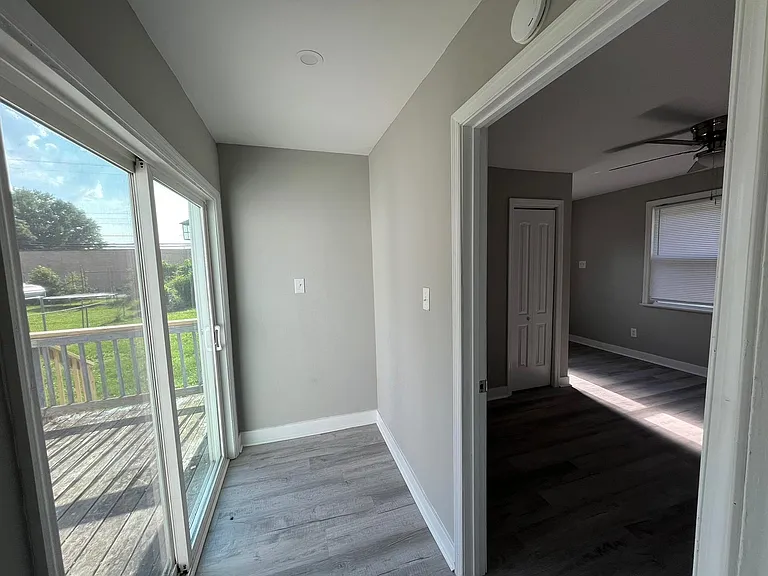 Door to deck (Left), Entrance to bedroom (Right)