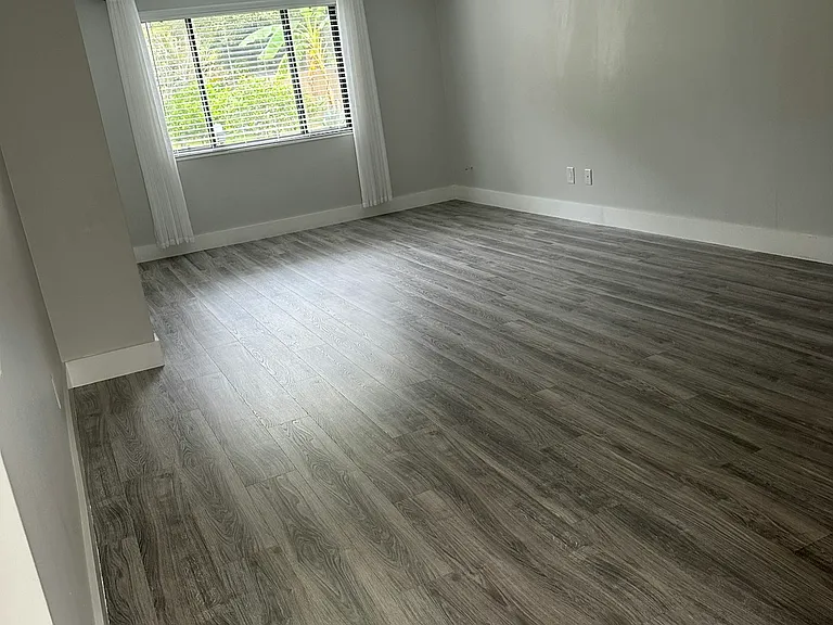 living room window with backyard view