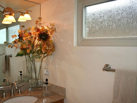 1st floor 1/2 bath. Granite sinktop, new faucets, which have extension hose.