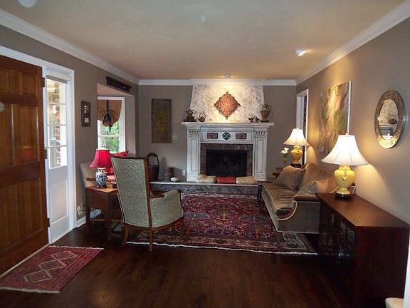 Luxury and charm are displayed by the cutom mantle, hardwood floors and cozy w