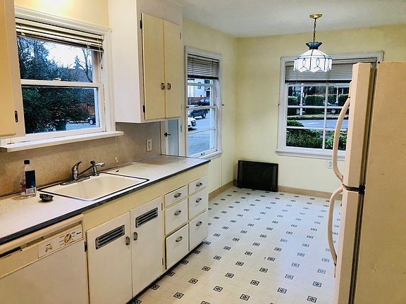 Two entrances to the kitchen. View of kitchen from North doorway.