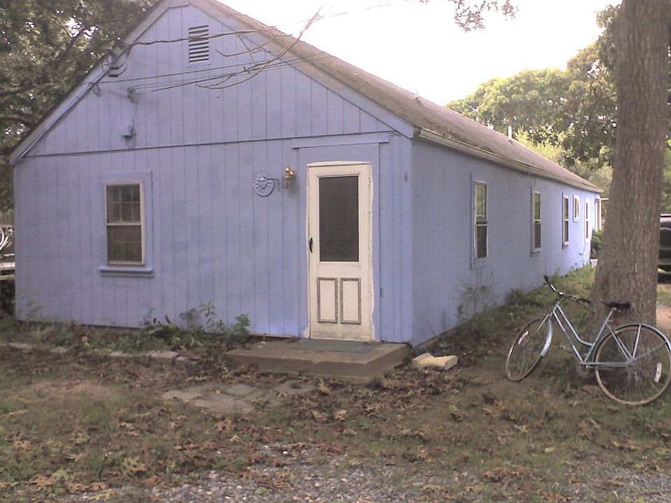 has since been painted fully with white trim and new roof