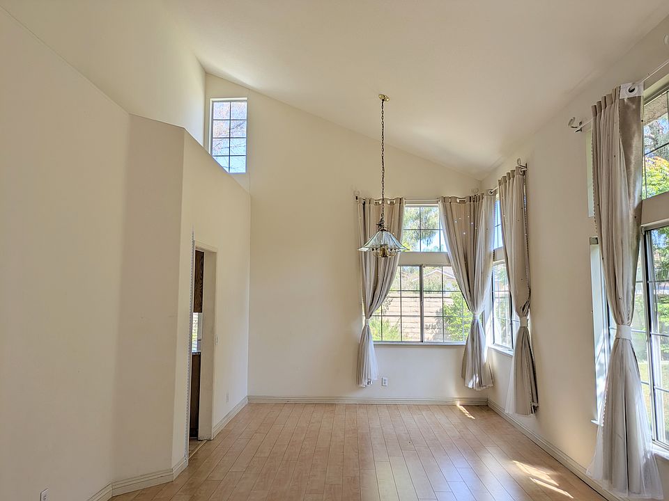 Living Room with Vaulted High Ceiling