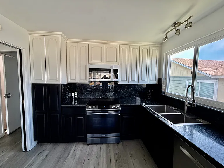 Kitchen has new floors and plenty of storage space