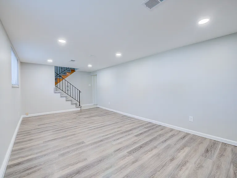 Lower level family room with canned lighting.