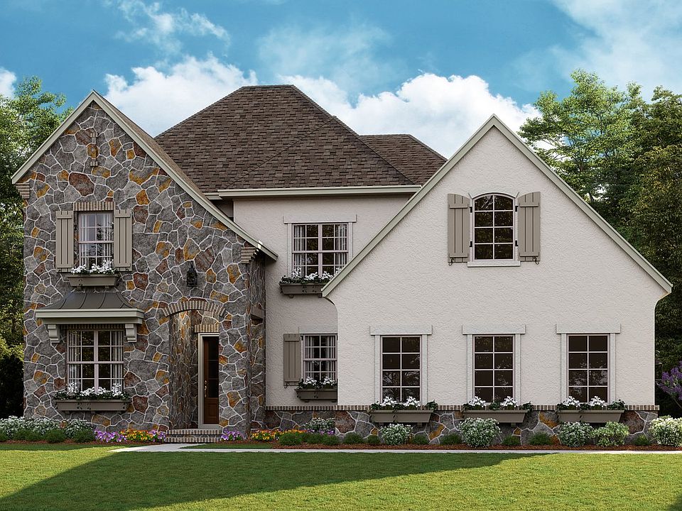 Huntley - French Cottage c 3-Car Side Load Garage Note Renderings may show optional features