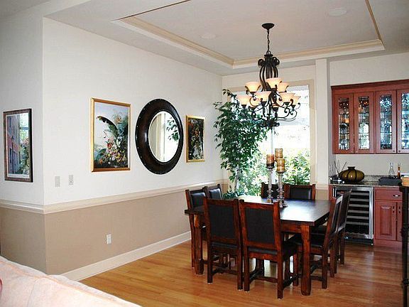 Viking wine cellar with slab granite countertop and china hutch