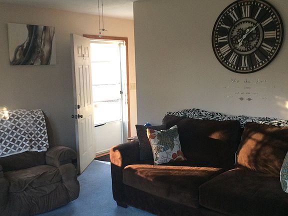 Living room looking from the front door. The door seen her enters from the outside to the kitchen or living room or to the stairs.