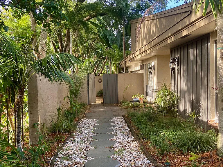 Front of the house with large beautiful mature trees