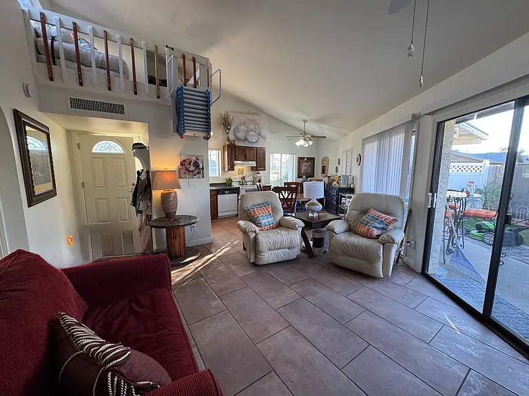 Living room & kitchen views along with a glimpse of the loft.