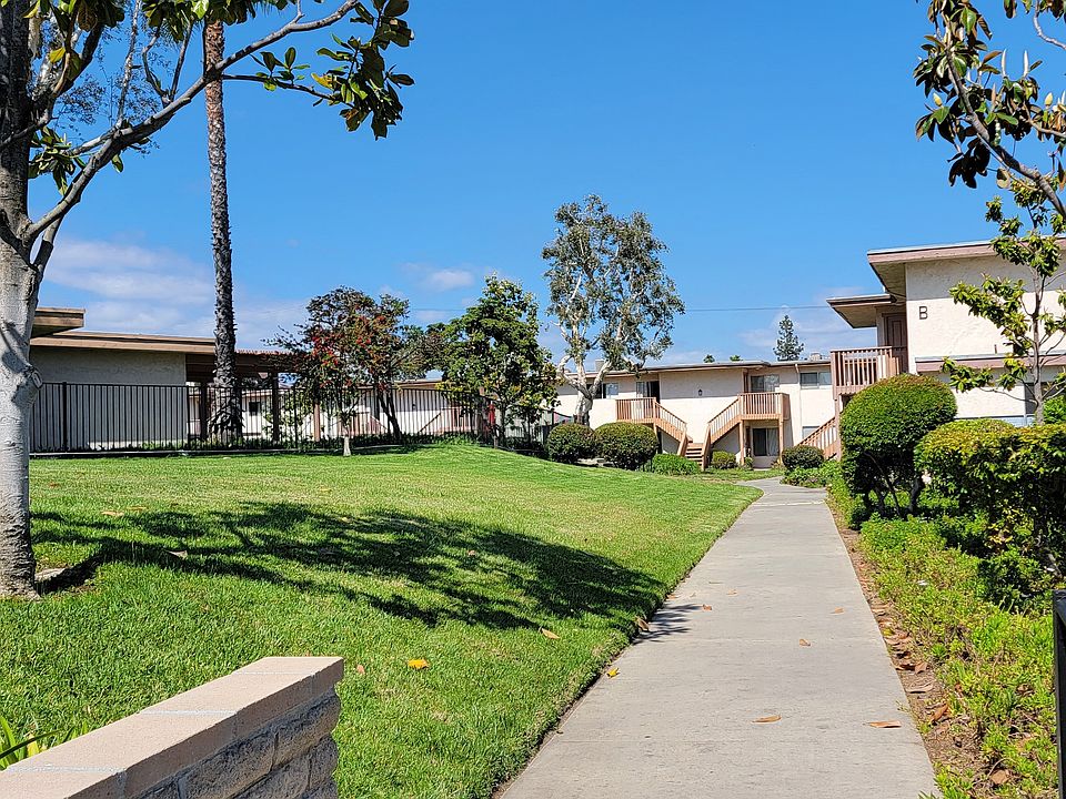 Walkway between apartment buildings at Plaza Verde Apartments in Escondido, California.