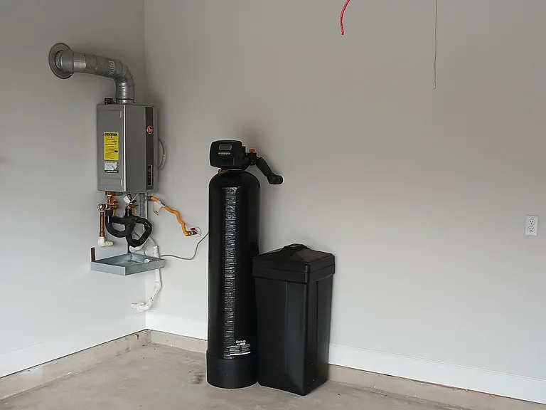 Tankless water heater and whole house water filtration/softerner
