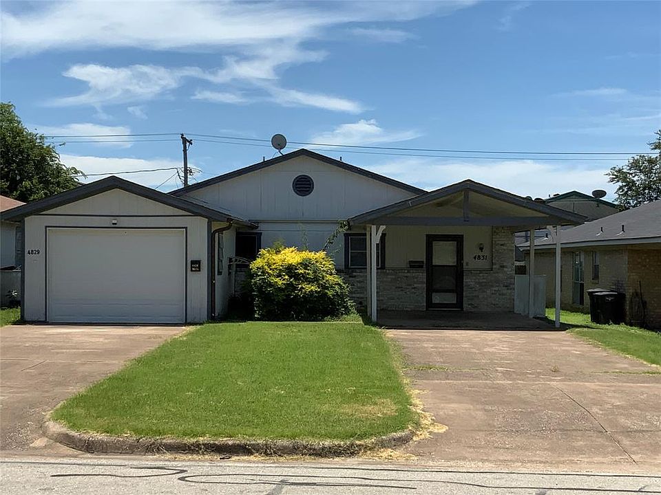 4829 Houghton - Ranch-style duplex with concrete driveway, a front lawn, covered porch, and an attached garage