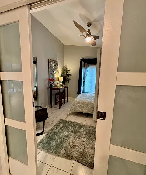 Designer green glass pulldoors infront of Office/library/Murphy Bed; illumintes green hue at night when lit inside; so pretty!