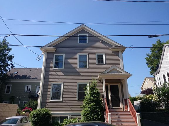 Tandem 2 space driveway located to left of unit with security motion light.