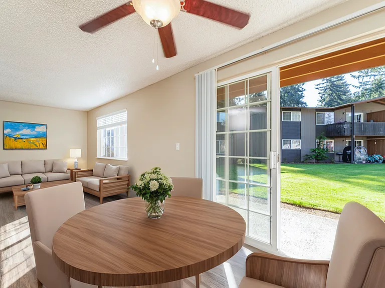 Experience the comfort of a modern living space with ample natural light and a serene outdoor view. Experience the comfort of a modern living space with ample natural light and a serene outdoor view.