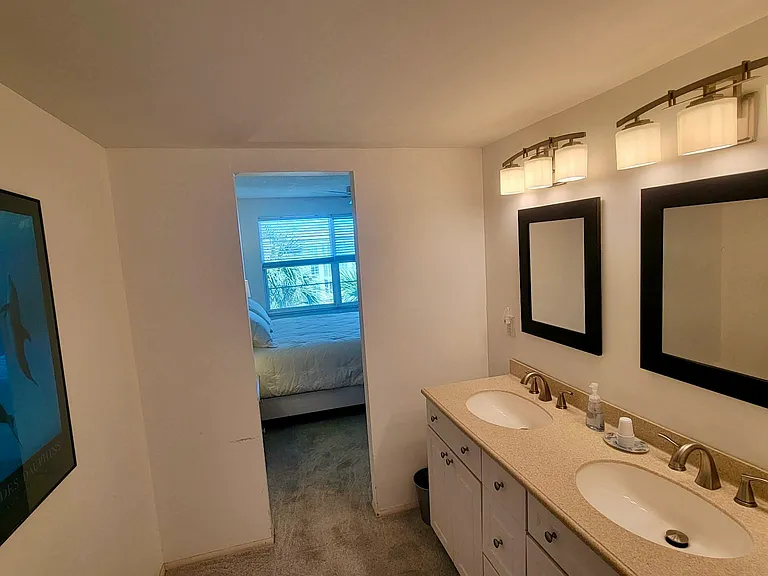 Spacious master room two-sink bathroom.