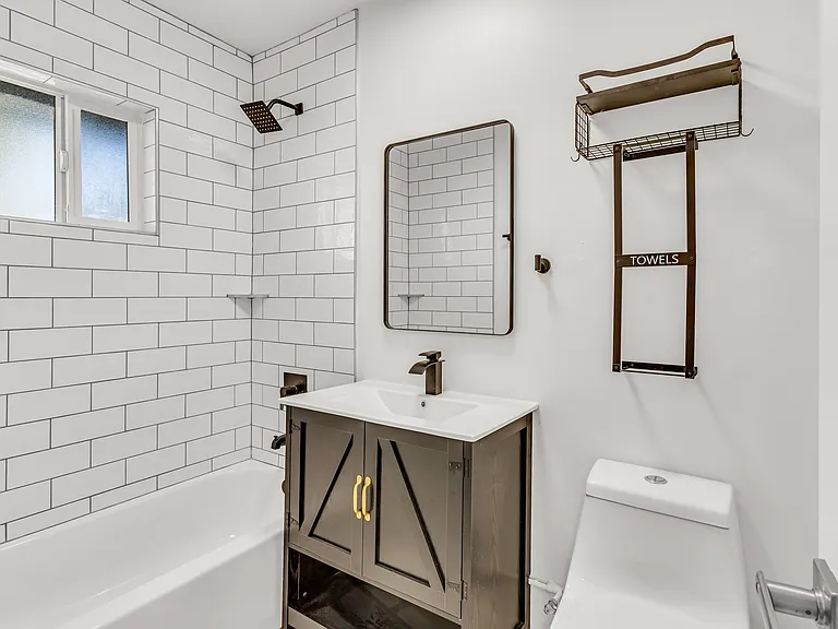 Sleek subway tile, updated fixtures, and a clean modern aesthetic.