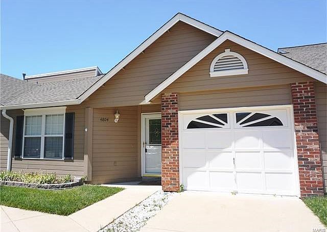 Affordable one level villa with attached garage.