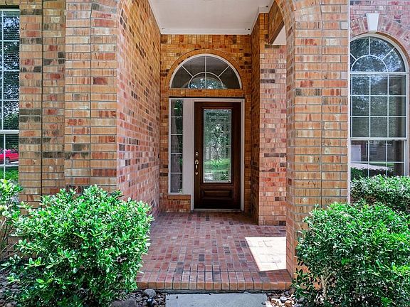 Covered front porch welcomes guests.