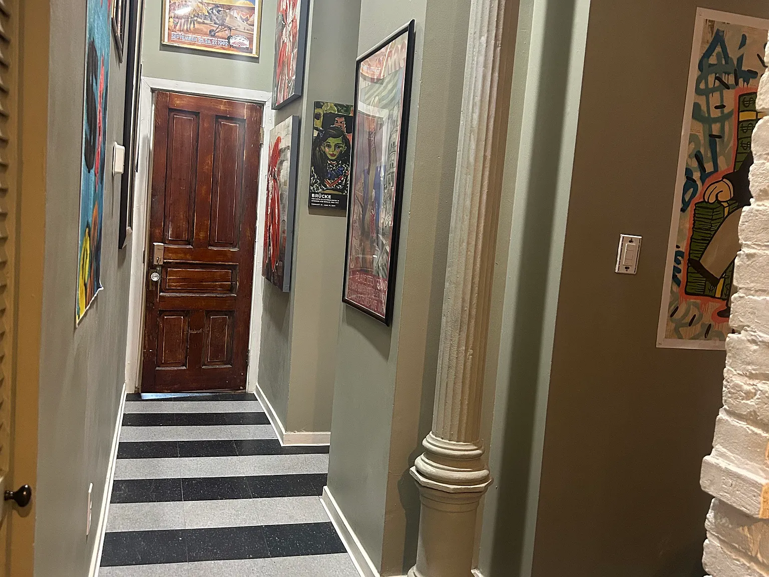 front entry inside Apartment A, also showing part of the loft sleeping area.