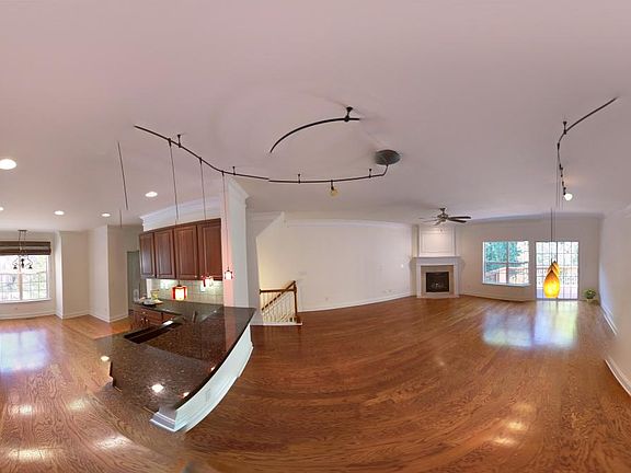 Panoramic photo of the living/dining and kitchen area