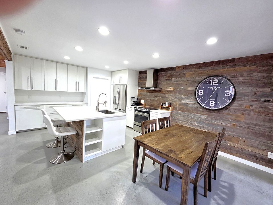 Dining area with wood accent wall