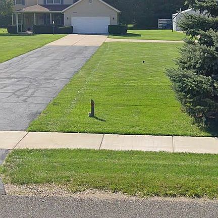 House sits near back of lot 