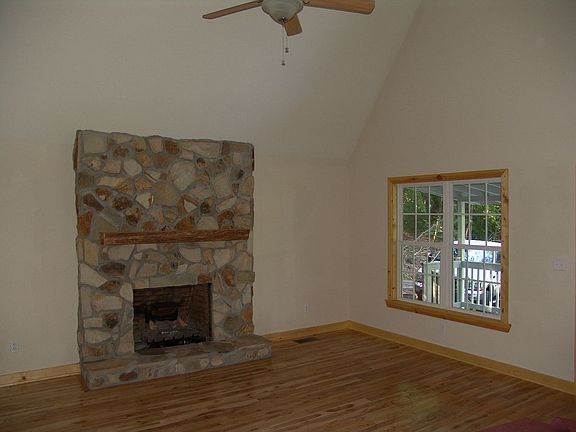 Vaulted ceilings make a light and bright space for this living room.
