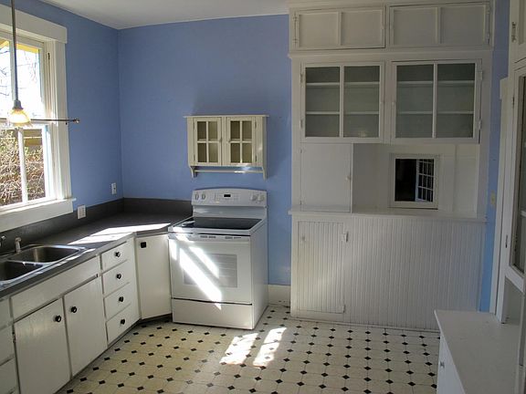 Large kitchen with stove and refrigerator