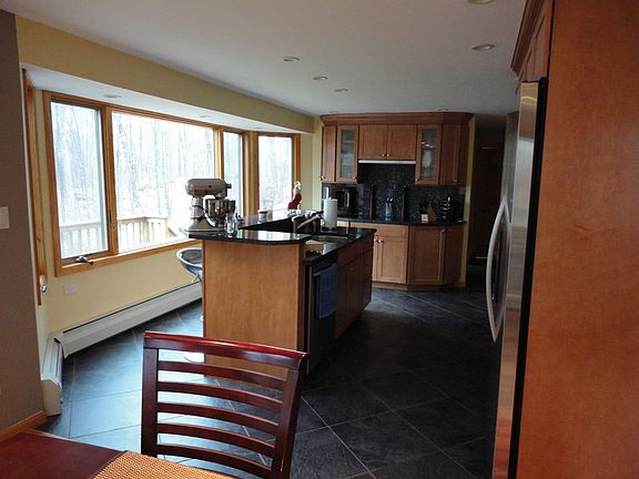 Kitchen with island, serving bar