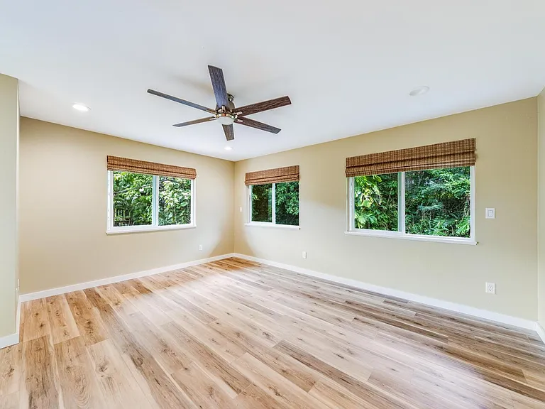 Spacious master bedroom with views overlooking the Palolo valley