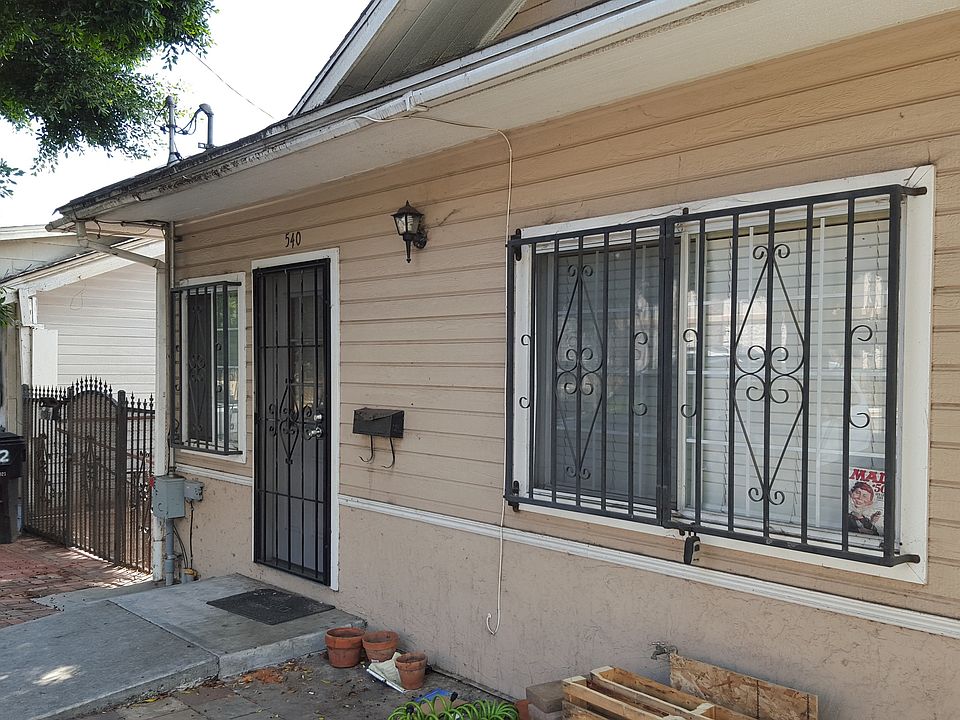 Front of Duplex-gate to left is entry to lower level unit