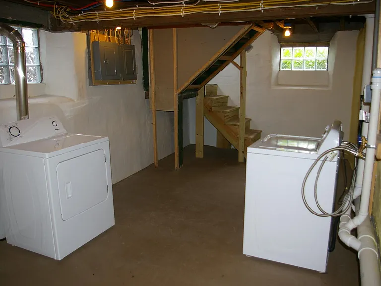 Laundry room in basement, appliances included