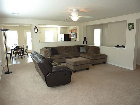 Living room is open to the kitchen area and hallway