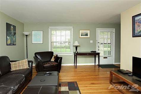 Spacious living room with hardwood floors
