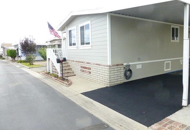 Front of home- New Energy efficient windows, new siding, brand new roof new slurry seal driveway