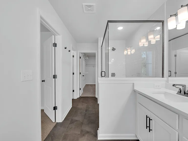 Another view of the master en-suite bathroom with a walk-in shower.