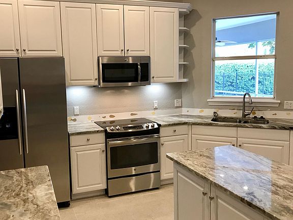 Quartzite counter and white cabinet and tile is newly installed.