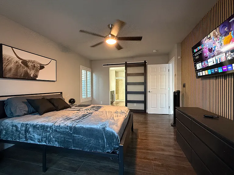 Ceiling fans for great air flow. Stylish barn door leads to your dual sink bathroom, large walk-in closet, shower, and more!