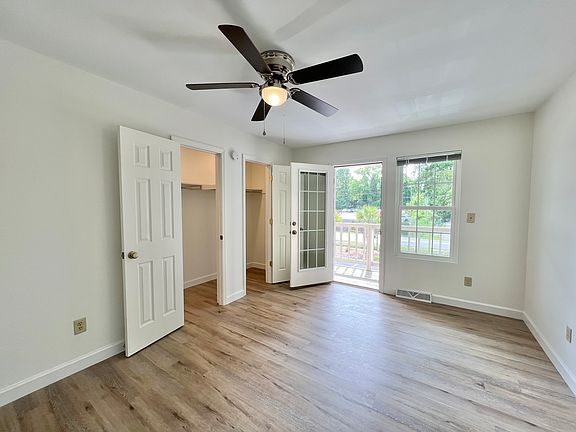Primary Bedroom (Upstairs - Front with Balcony)