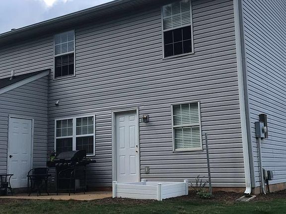 Back View w Flower/Garden Bed and Patio/Storage Unit