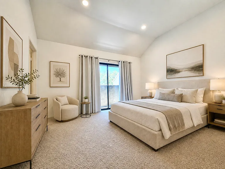 Primary suite with vaulted ceilings. Furnished photos are virtually staged for reference. No furnishings are included with lease.