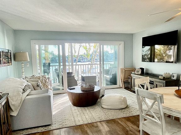 New hurricane sliders, large smart tv with cable and many streaming apps installed. Round dining table seats 5. Extra chairs if you have visitors.