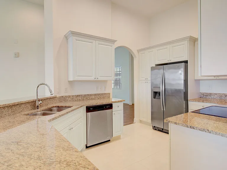 Broadmoor - Designer kitchen with stainless steel appliances and custom cabinetry