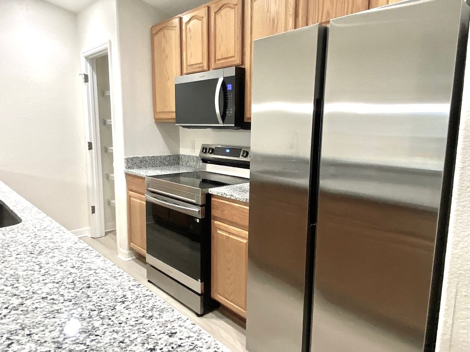 New stainless steel appliances, and granite counter tops
