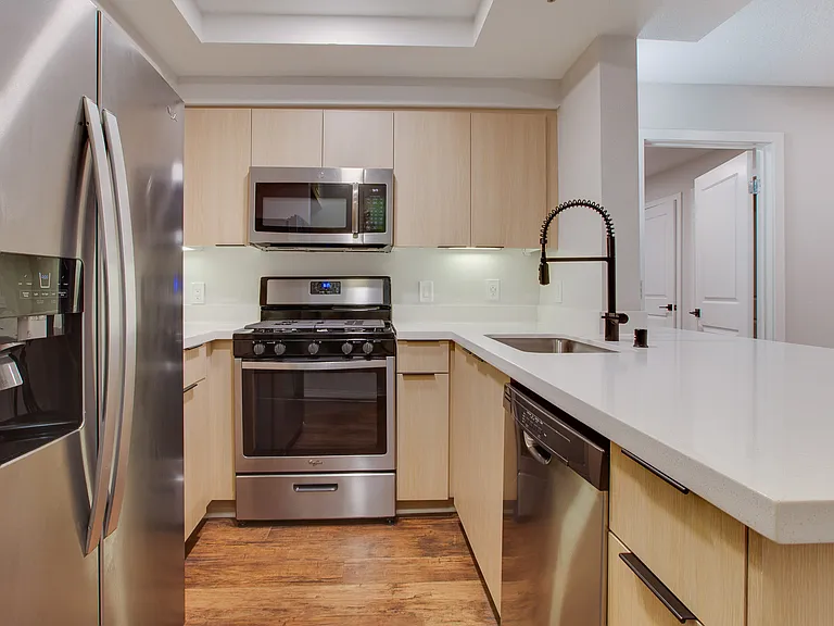 Kitchen includes granite countertops and stainless steel appliances