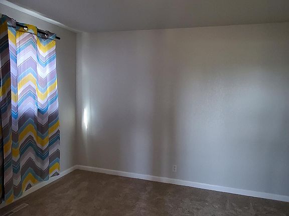 The larger of the two bedrooms aside from the master.