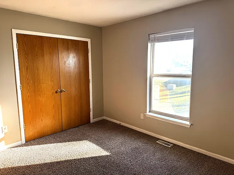 BACK BEDROOM WITH DOUBLE DOOR CLOSET